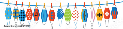 Colorful patterned face masks hanging on a blue string with clothespins
