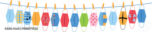 Colorful patterned face masks hanging on a blue string with wooden clothespins
