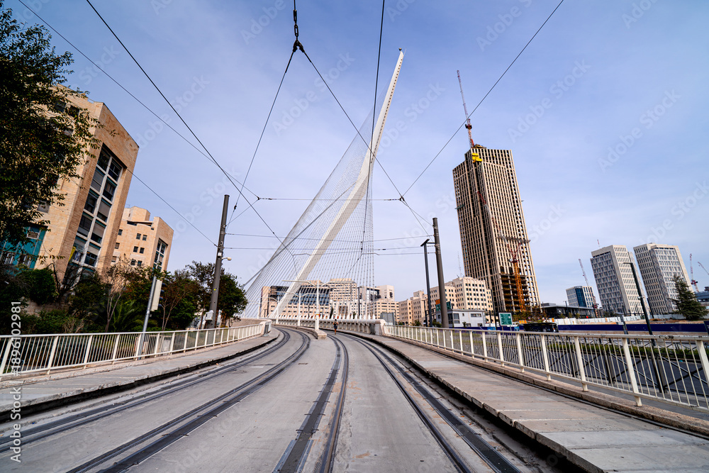 Fototapeta premium Chords Bridge in Jerusalem, light rail bridge with pedestrian overpass, Israel. Fascinating structures in the Middle East.