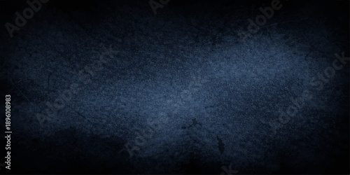 Dark blue grunge background with a vintage textured wall pattern featuring aged concrete and a rough dirty stone surface for an empty dark backdrop