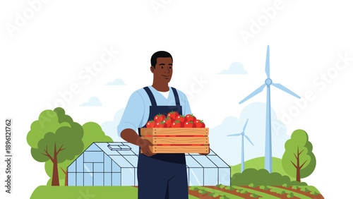 Smiling African American farmer in overalls holding a wooden crate full of ripe red tomatoes on a sustainable farm landscape with wind turbines.