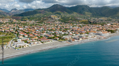 Aerial view of Tortora Marina, located in province of Cosenza, Calabria, Italy. It is a small coastal town on the Tyrrhenian Sea and a popular summer tourist destination. Mountains are in background.
