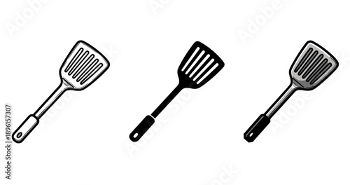 Set of three spatulas: black, white, and silver kitchen utensils