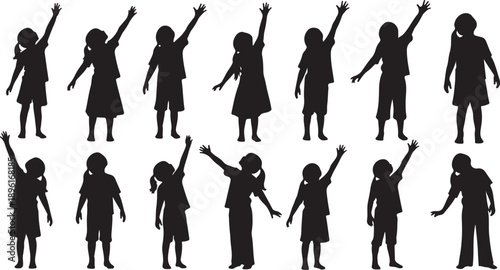 Silhouettes of people raising their hands in unison