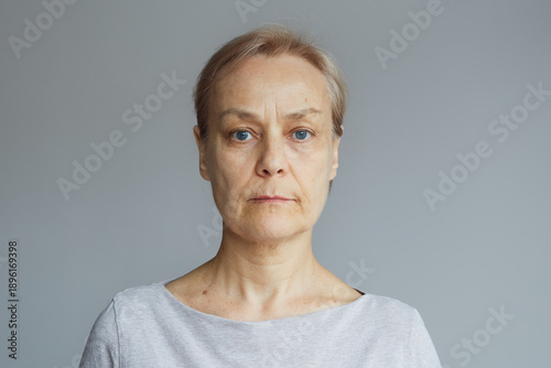 Portrait of a mature woman with a calm confident expression. Concept of natural beauty, healthy aging, lifestyle, and authenticity.