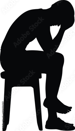 Sad man sitting alone on chair in contemplative mood
