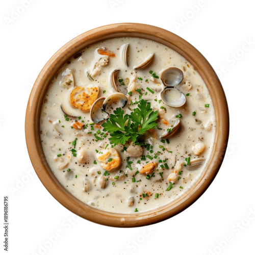 Creamy clam chowder in rustic bowl topped with parsley and chives isolated on white background