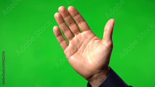 Human hand gesturing on green screen background for commercial use