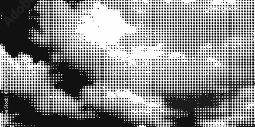 Abstract black and white grid pattern with scattered white shapes and dark areas