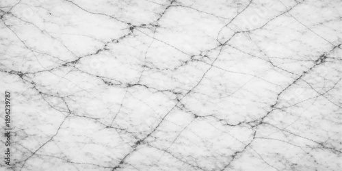 Old grunge white marble stone wall texture featuring a cracked grey rock surface with a rough weathered pattern for a dirty industrial cement floor backdrop