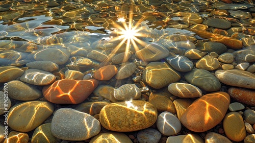 Wallpaper Mural Sunbeams on colorful pebbles in shallow water, ideal for nature backgrounds Torontodigital.ca
