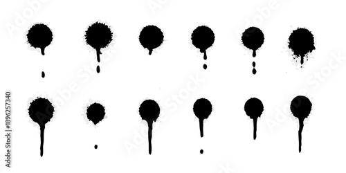 Abstract arrangement of black ink blots resembling scattered droplets or splatters