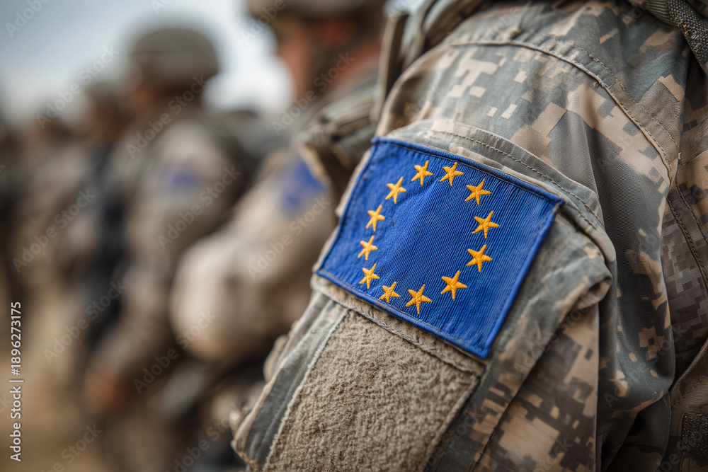 Obraz premium Military personnel showcase European Union flag on uniforms during a training exercise in a NATO joint operation in Germany, highlighting the collaboration within European defense forces