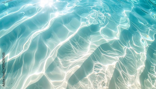 Close-up of sunlit, turquoise water with intricate patterns of light and shadows