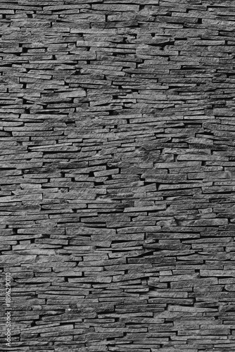 Dark Grayscale Stacked Stone Wall Texture with Horizontal Arrangement