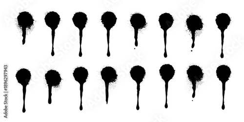 Abstract black ink drips arranged in a grid pattern on a white background