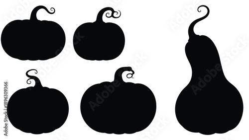 Black pumpkin shapes with curly stems a striking silhouette