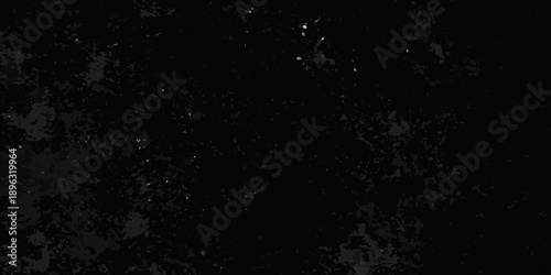 Dark grainy texture with scattered bright specks resembling a night sky