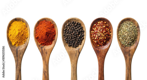 Set of six rustic kitchen utensils filled with turmeric pepper chili and dried seasonings isolated flat lay