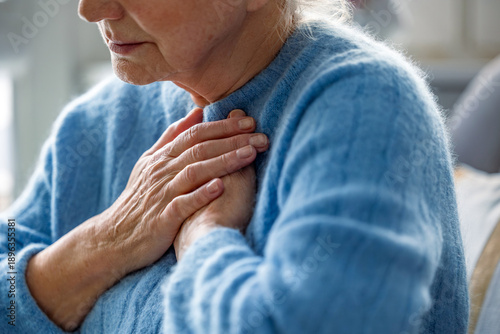 Senior woman suffering from chest pain
