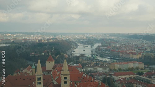 Wallpaper Mural A breathtaking view of an urban landscape featuring intricate architecture, a serene river, and distant hills. The image captures the coexistence of nature and city life, highlighting the beauty of ur Torontodigital.ca