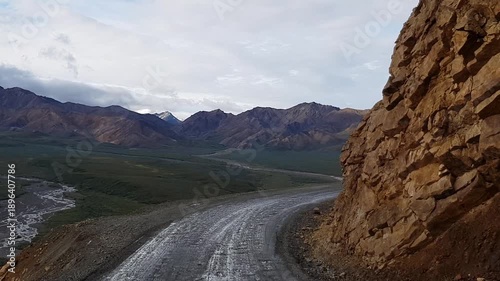 View of scenic road drive in Denali National Park with view of Denali mountain 