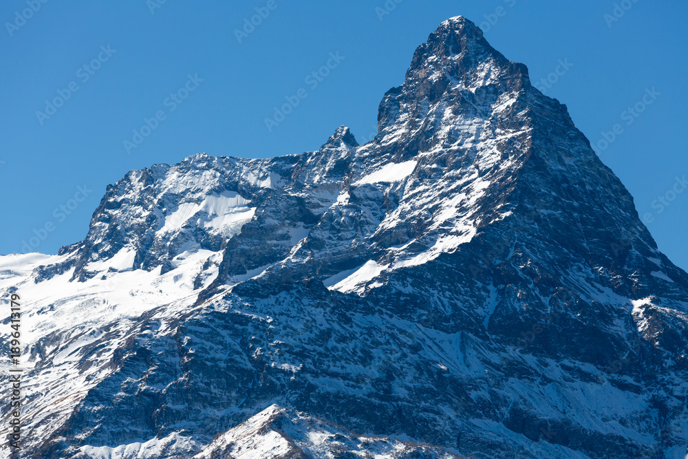 Obraz premium Landscape of snow-capped peak of Mount Belalakaya in the Teberda Nature Reserve