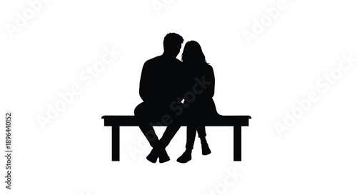 Couple sitting on a bench embracing in a dark silhouette