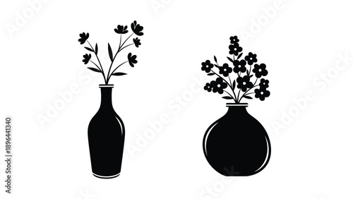 Two black floral arrangements in vases a striking silhouette