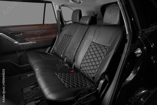 Tableau sur toile Rear car seats with black leather upholstery and textured surface