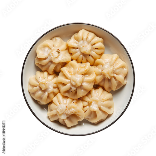 Dumplings Arranged in a Bowl Served on a Patterned Plate in a Restaurant Kitc...