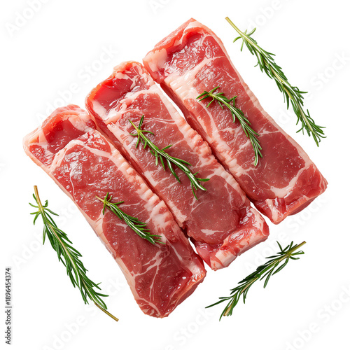 Fresh Meat Cuts Placed With Rosemary on a White Surface for Cooking Preparation