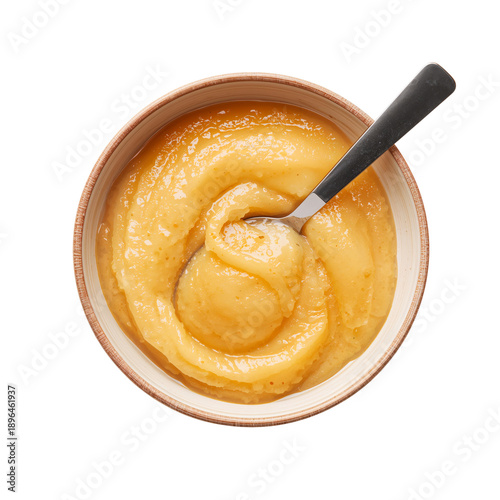 Serving of Smooth Yellow Applesauce in a Wooden Bowl With a Silver Spoon Rest...