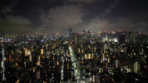 Wallpaper Mural Vue aérienne nocturne du quartier d’Asakusa à Tokyo avec la Tokyo Skytree illuminée, paysage urbain japonais mêlant architecture traditionnelle et skyline moderne Torontodigital.ca