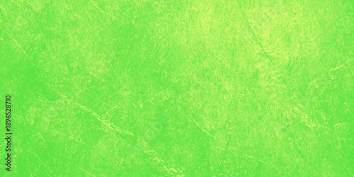 Abstract green and yellow paint creates a grunge texture on an aged vintage parchment paper backdrop with a stained antique design and dirty canvas pattern