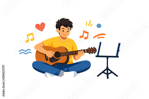 Young person plays guitar while sitting on the floor and enjoying the music in a bright setting during the day