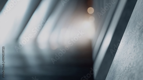 Long, narrow hallway with a wall of grey concrete