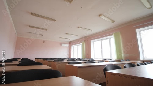 Empty Rows Of Desks With Chairs In Classroom in School, College
