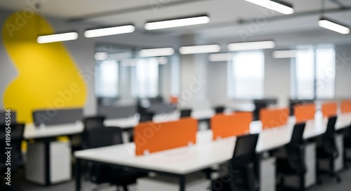 Office workspace with yellow and orange abstract shapes on desks and chairs