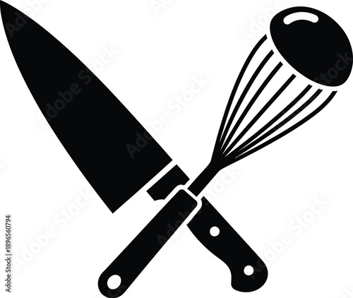 Chef knife and a wire whisk kitchen utensil. 