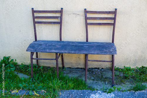 Rustic Wooden Bench Against a Wall