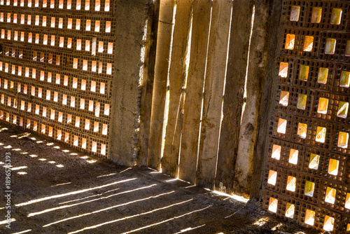 Sunlight and Shadows Through Perforated Brick Walls