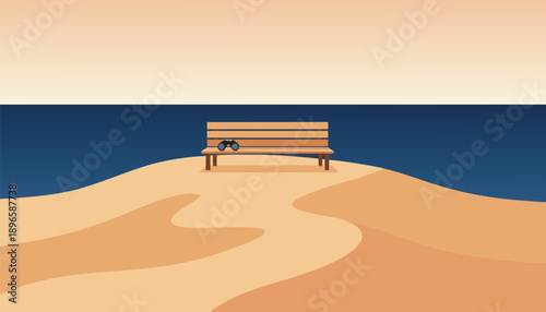 Empty wooden bench on a sandy hill overlooking the ocean at sunset.