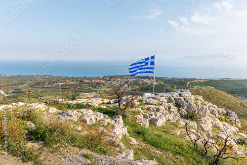 Panoramic view of Alexandroupoli city, Evros Greece from the hill of Saint Ilias church, orthodox cross and greek flag, burnt area after massive wildfires