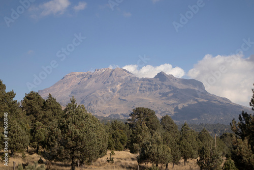 View of Iztaccihuatl volcano on the Paso de Cortés trail in the State of Mexico. Outdoor hiking in Mexico