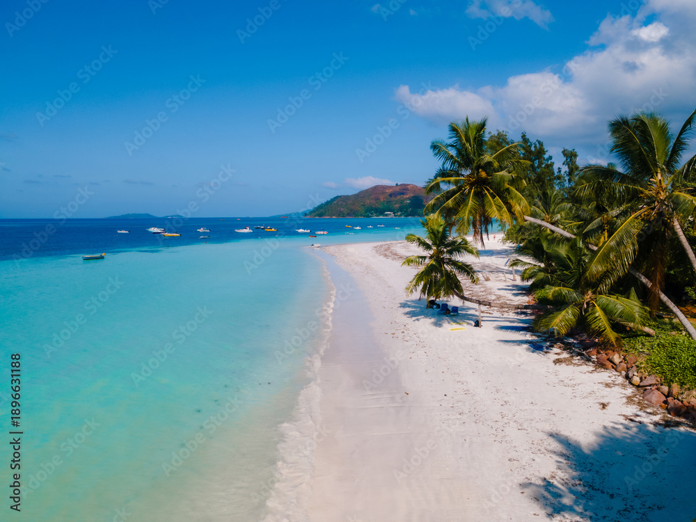 Fototapeta premium Serene beaches and crystal-clear waters at Grand Anse in Praslin, Seychelles