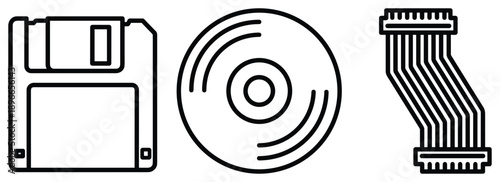 Floppy disk cd and cable computer parts for vintage storage and connection technology.