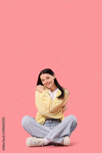 Beautiful young woman huggi...