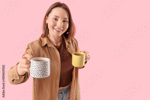 Young woman with cups of te...