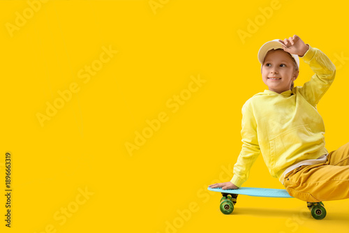 Cute little girl sitting on...